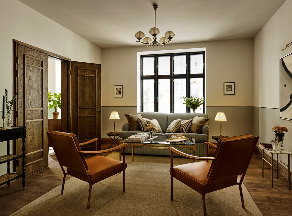 Sitting room with rattan furniture and brass fittings in a Copenhagen hotel